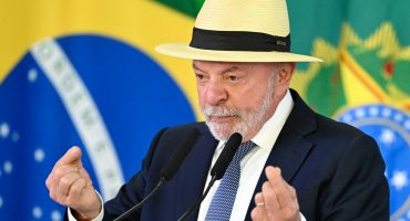 Brazils President Luiz Inacio Lula da Silva speaks during the signing of the law establishing a line of credit for companies affected by the new tariffs imposed by the U.S. government, at the Planalto Palace in Brasilia on July 22, 2026. (Photo by Evaristo Sa / AFP)